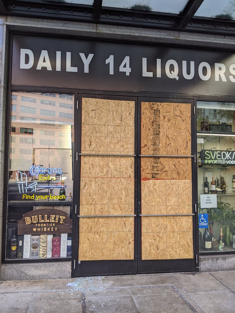 Daily 14 Liquors, a mom-and-pop near Thomas Circle, had its doors smashed. Glass bottles in the street outside suggest looting.