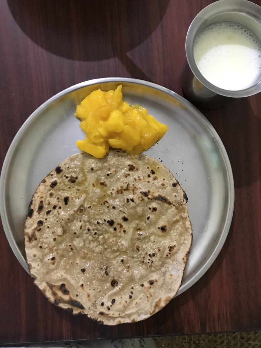 alphabetiya's tweet image. Phulka with ghee, mango from our tree and milk #simplesupper #Lockdown
