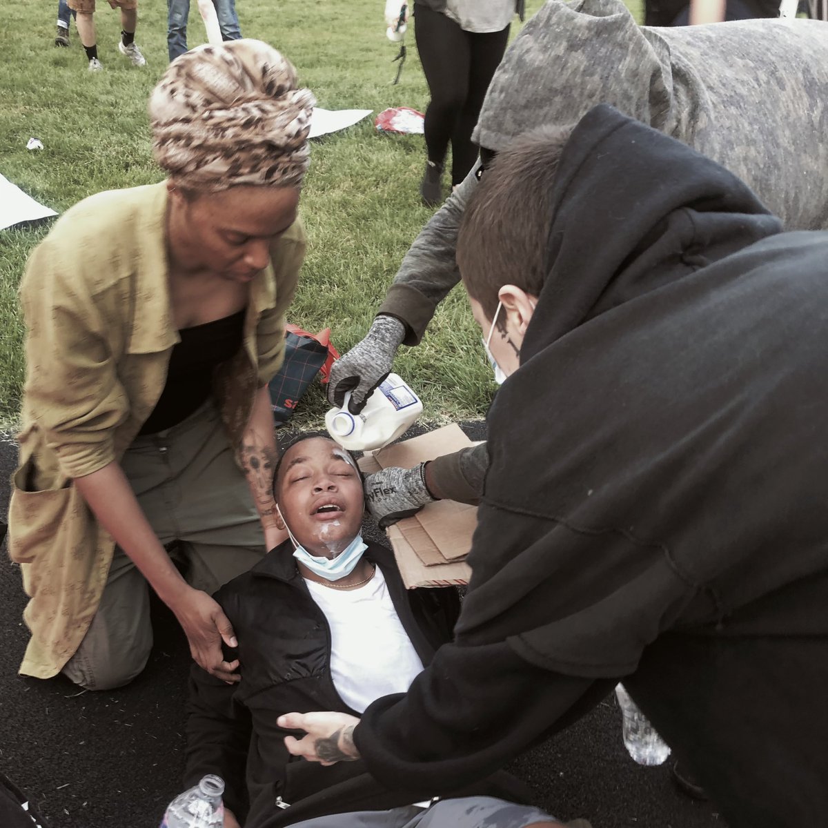 BarthelTaylor's tweet photo. #KCprotest 
we stand together , i want to give a big thanks to @BlakeBarnes12 for his random act of kindness (a lot of other people as well) for shielding me while they sprayed tear gas in my eyes, i want peace , i want love , i want our voices to be heard , is my brother next ? https://t.co/rbXOml7Mm8