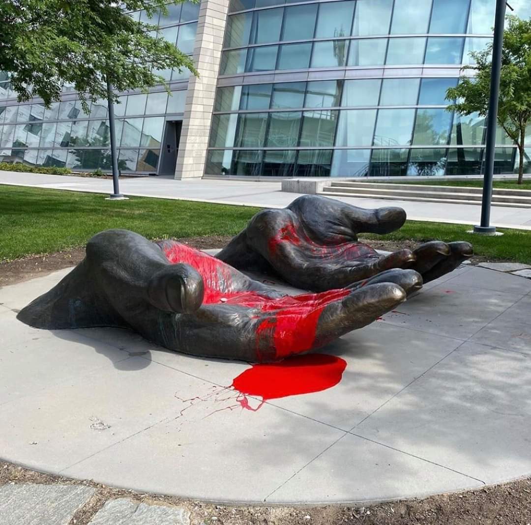 ImNotAVampire21's tweet image. #Riot2020 &quot;Serve and Protect&quot; statue with red paint placed on the hands in Salt Lake City Utah. Very powerful message.