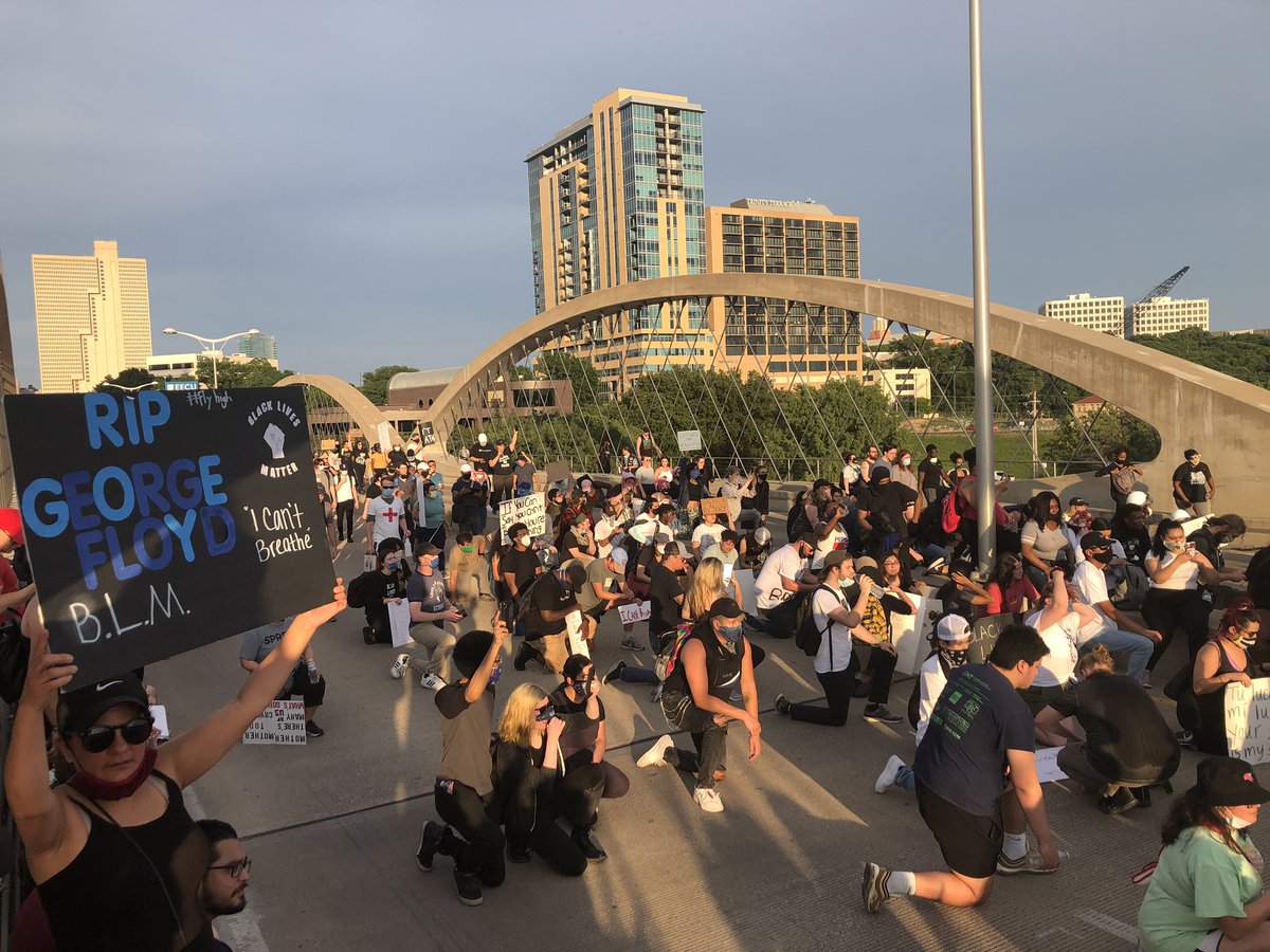 Recap. Protesters started downtown, marched peacefully for about 2 hours. Now, we’re on Trinity Bridge. officers blocking protesters from going to West 7th (lots of businesses there). Leaders tried to get ppl to leave, but many will not, say theyre peaceful.  #GeorgeFloydprotest