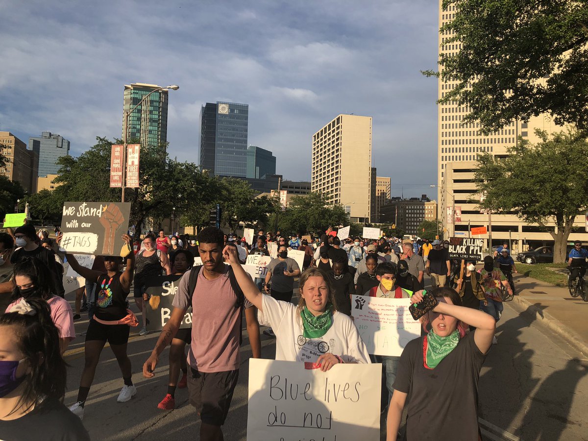 Recap. Protesters started downtown, marched peacefully for about 2 hours. Now, we’re on Trinity Bridge. officers blocking protesters from going to West 7th (lots of businesses there). Leaders tried to get ppl to leave, but many will not, say theyre peaceful.  #GeorgeFloydprotest