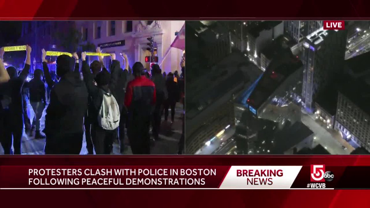 MBTA Transit Officer who had protesters jump on top of vehicle on Beacon Street appears to have left scene safely. Signs of 'Hands Up, Don't Shoot' held as backup officers arrive on scene. #BostonProtests