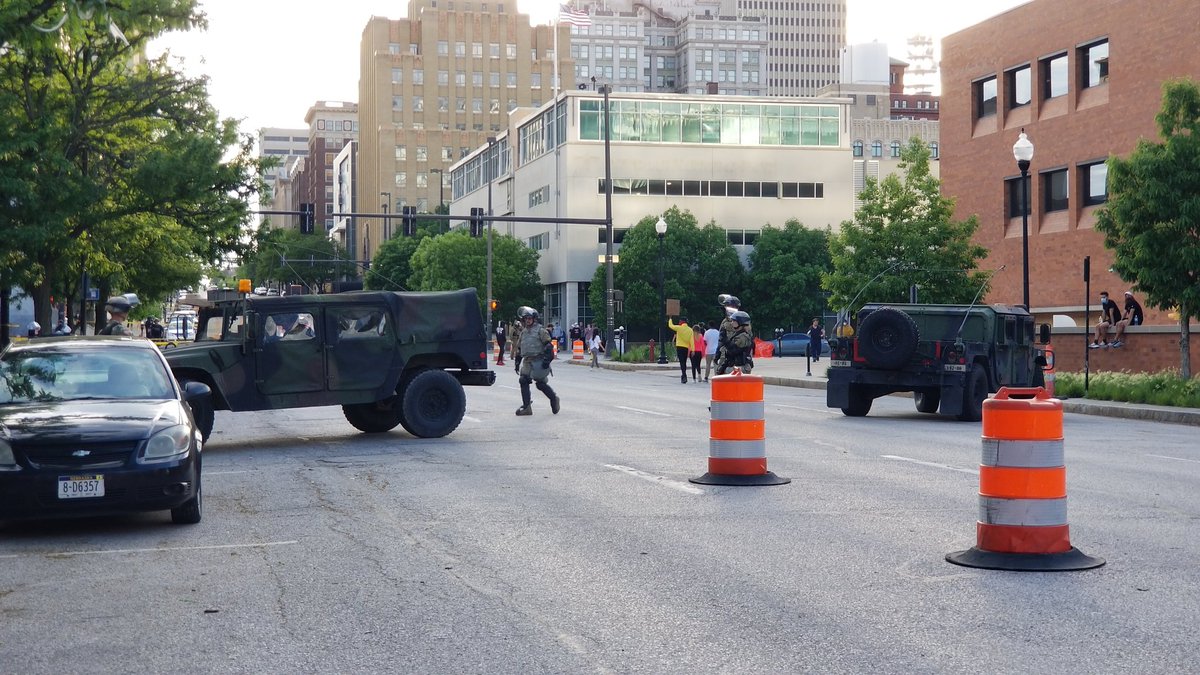 30 minutes to curfew, and National Guard humvees are being positioned near the protest spot.