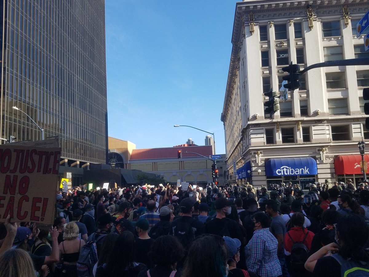 Police line is still at Second and Broadway though some on the sidewalk are behind it. Officers are holding positions to keep that part of the crowd on the sidewalk.