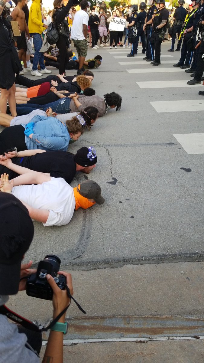 Folks have backed the cops up by laying down, moving, laying down again