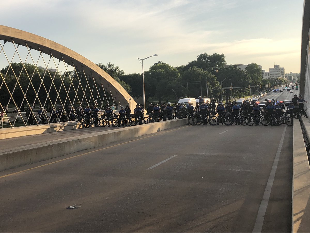 Again. We are on the trinity bridge in Fort Worth. Police are blocking one side. Protesters are locking arms and marching toward them.