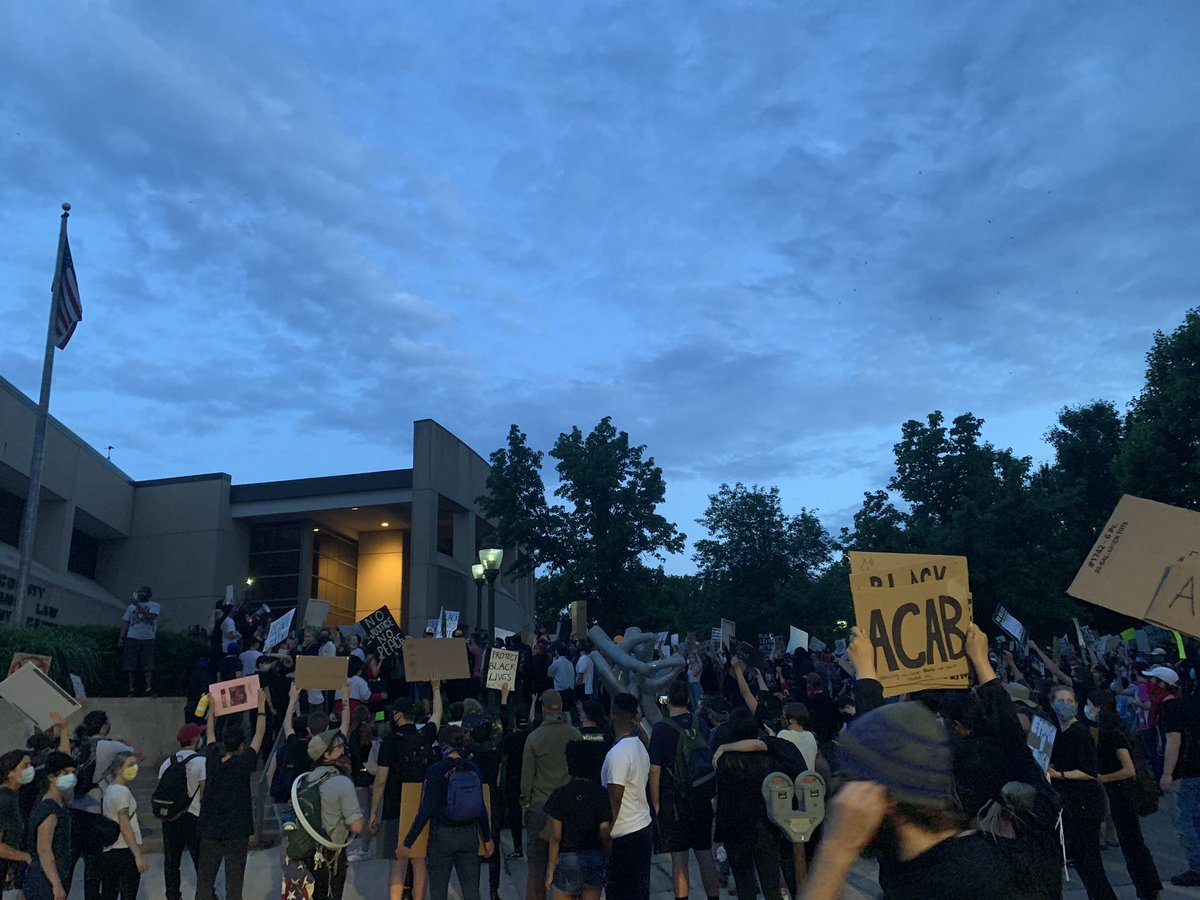 MelissaStiehler's tweet photo. #LFKprotest marched to the police station and have torn down the American flag. They’ve taken most of the street. Still can’t see any police around. Chanting #FTP and #blm. https://t.co/IeRYuistUd