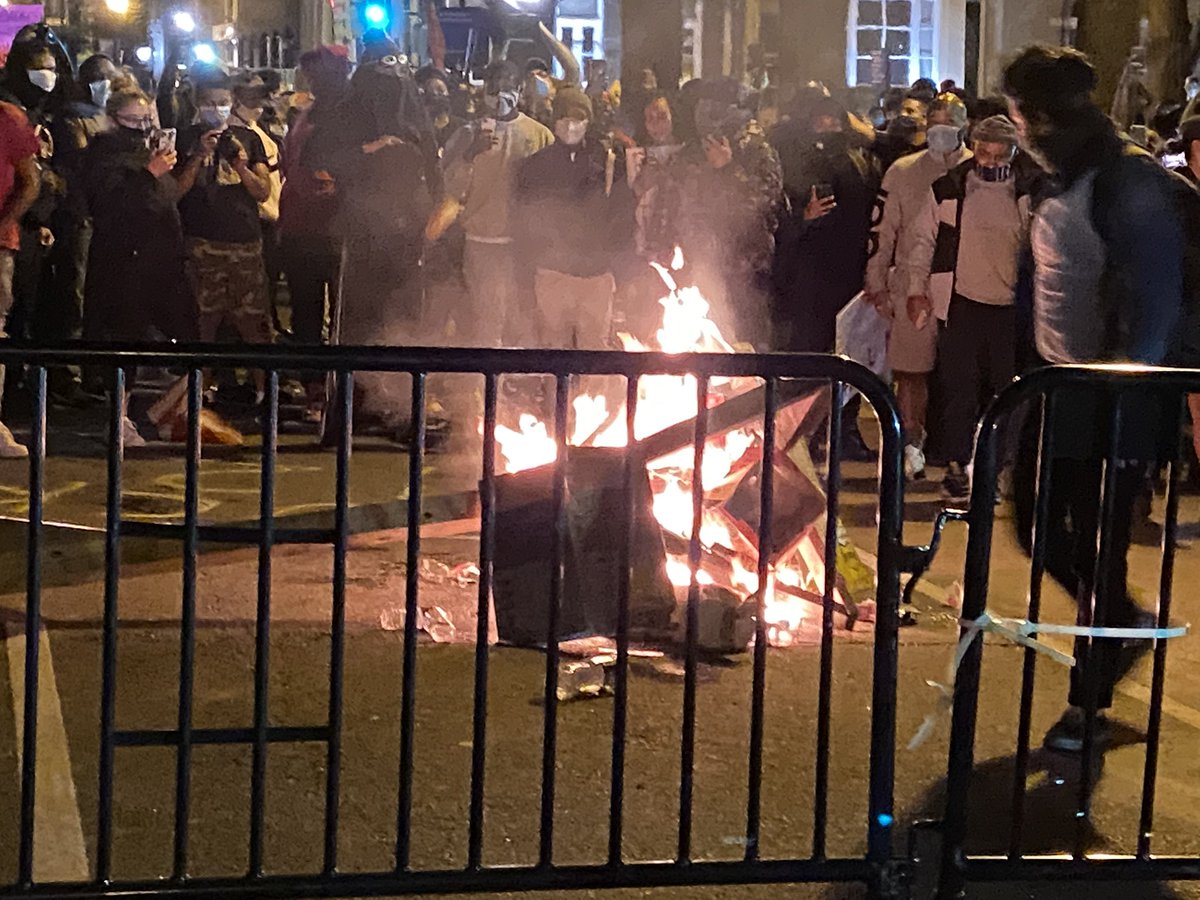 Protesters started a large fire with a street sign on h street and Vermont. No justice, no peace, they chanted, as someone shot off fireworks in the background