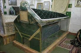 The epigraphic panel is placed at the foot of Bilāl's large cenotaph, which is at the center of the mausoleum. It reads: Bismillah al-raḥmān al-raḥīmThis is the tomb (qabr) of Bilāl ibnHamama the mu'adhdhin of the Messenger of God. May God bless him and be pleased with him.