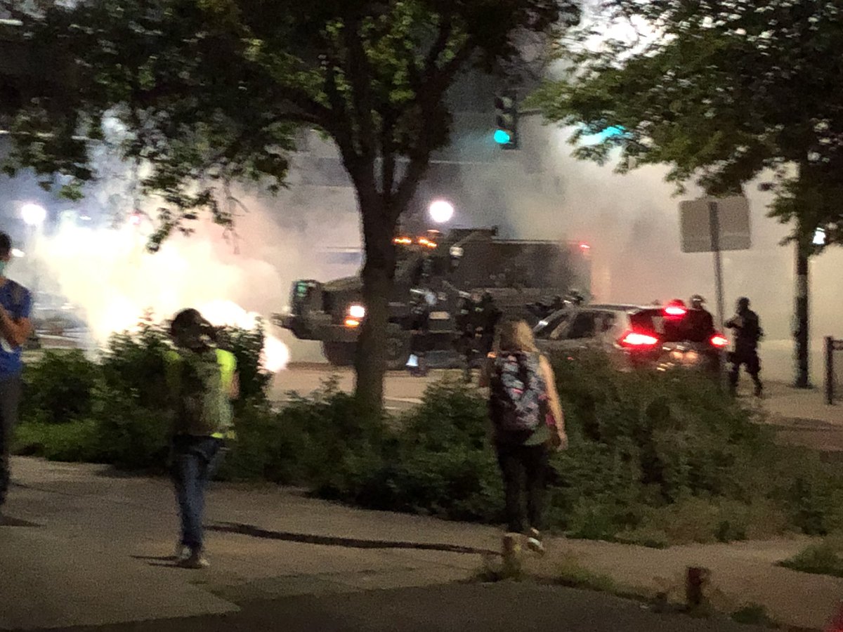 People scream and scatter and all you can see on Colfax is gas, and then this police vehicle emerges.