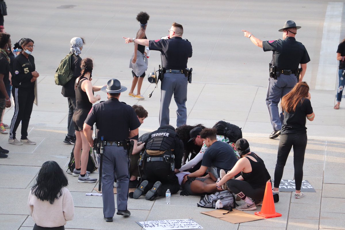 NEStatePatrol's tweet image. Earlier tonight at the Capitol during a peaceful protest, a young female suffered a medical incident. Protesters and Trooper Gardine (an EMT) worked together to care for her until paramedics could arrive. 

A touching moment when the crowd applauded Trooper Gardine’s efforts.