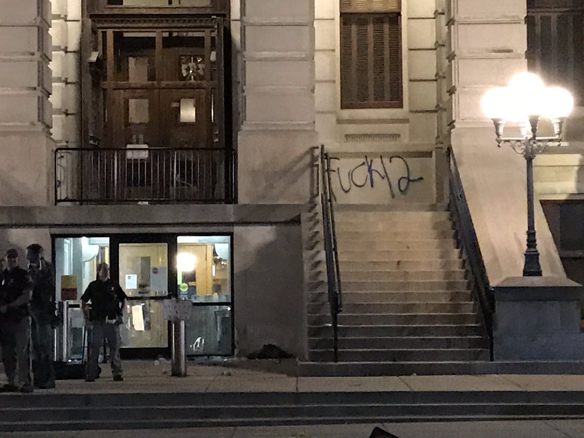 Courthouse tagged with anti-cop graffiti.