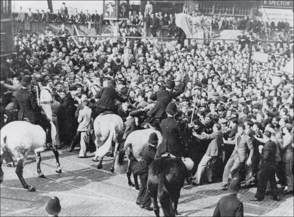 1936, Cable St, London, Police were sent to protect a March by the BUF (British Union of Fascists). Despite being attacked by police, a loose coalition of anarchists, communists, jewish immigrant communities, irish dockworkers & trade unionists managed to get the march disbanded.