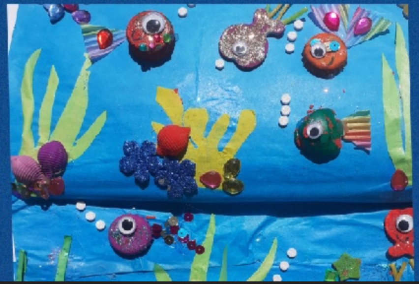 YBB_Y1's tweet photo. Someone has been having creative under the sea fun doing their bottle top craft task! How clever! 🤩 Those fish look very happy swimming around - Da iawn i ti!🐠🐟🐚🌊🐡#homelearning #creativetask #imagination #recyclableart https://t.co/aYHCK8S6U2