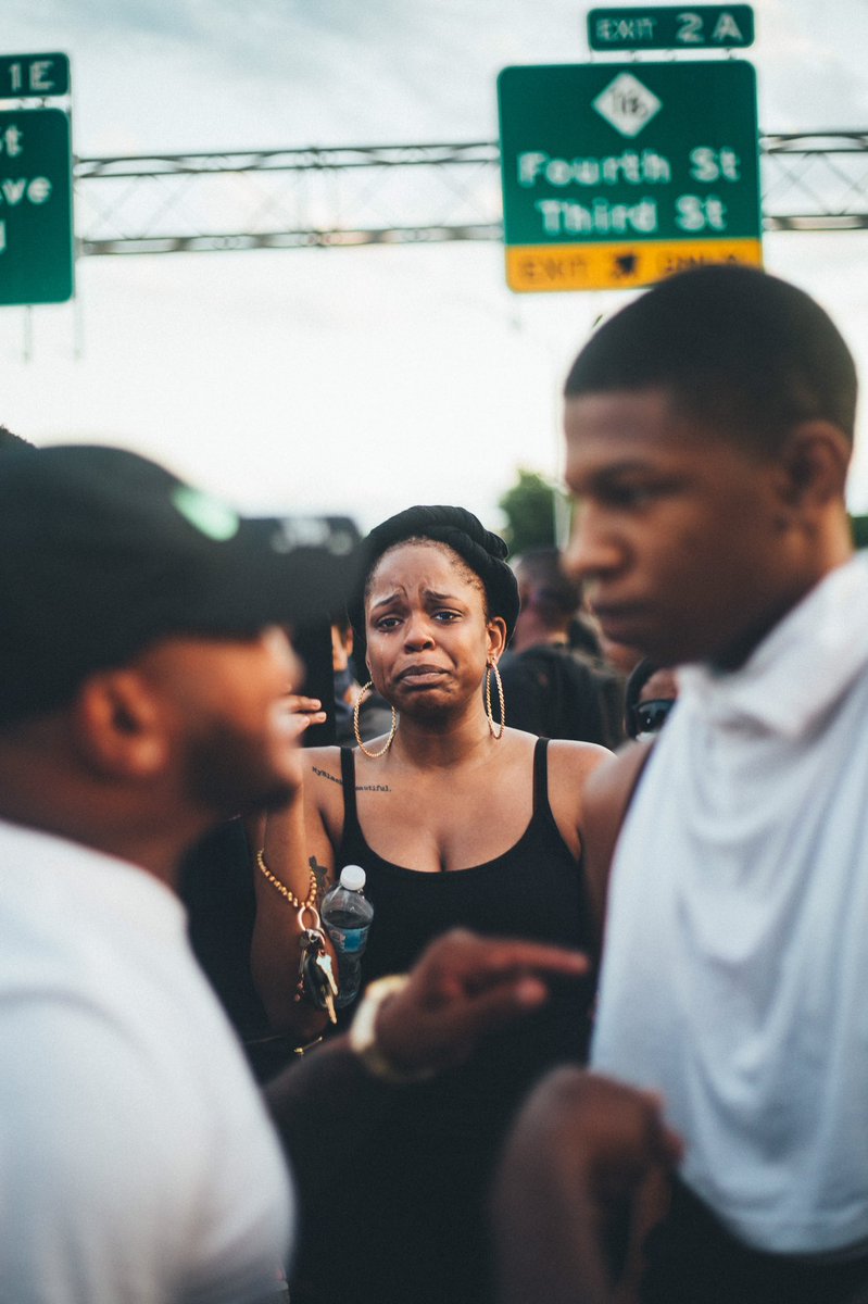 Starbeezy___'s tweet photo. Charlotte, NC 2020 protest. This past weekend my brother went out to capture life during the #GeorgeFlyod #BrionnaTaylor #AmaudArbery protest. The pain, outrage, discomfort &amp; power you feel from these photos speaks extreme volumes! We are not okay! PLS RT 
his IG: jodamann https://t.co/6h2QyTlKhh