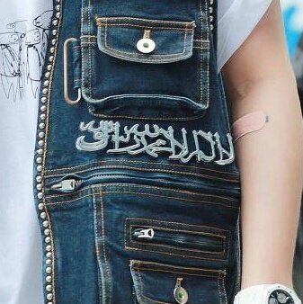 as a muslim im so offended by this. the "accessory" in this arabic characters is the Shahadah. Islam is not an aesthetic its not something you can make as an accessory for your outfit just like that