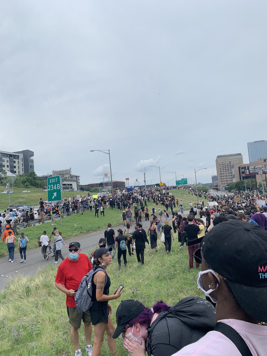 Eventually we made our way back to the capital, and started circling around to walk towards the police headquarters. This is also where I-35 has an overpass with the street below. About half of the group (including ya) went to the highway, blocking traffic (7/?)