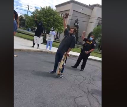 BennettLoudon's tweet photo. Cops in Geneva raise fists with protesters outside Police HQ https://t.co/G4RWFjrqSS