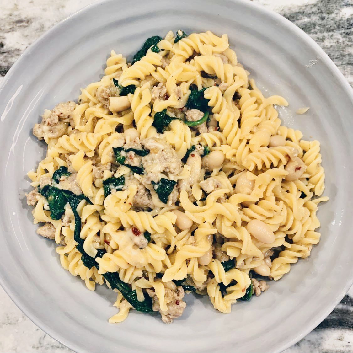 #SprialPasta #ItalianTurkeySausage #DicedRedOnion #OrganicSpinach #CannelliniBeans #RedPepperFlakes #FreshParmaCheese #ExtraVirginOliveOil #EatPGH #FullOfFlavor #TrueCooks 🍝🦃 🧅👌👌👌