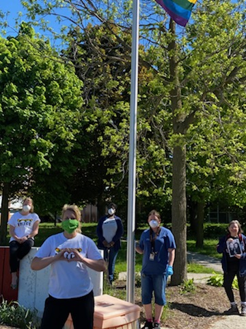 WCIinfo's tweet photo. The raising of our Pride flag at school. #wrdsbPride @wrdsb we were so good at following public health recommendations that we almost social distanced the entire flag from the first photo. Thankfully you can still see the bottom. https://t.co/YQsGfOZvCy