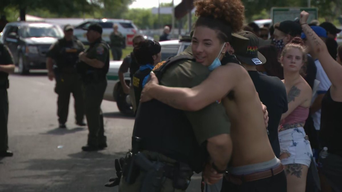 NC5's tweet photo. There. Is. Good. As we end another day during this disheartening time, remember these images. Officers are engaging with protesters with hugs, prayers and bent knees. These are photos from Nashville, Murfreesboro and Chattanooga. https://t.co/TWJncQkPtn