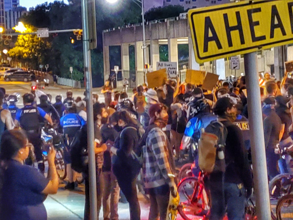Hookem_96's tweet photo. This is what a peaceful protest looks like. Folks have been talking with our officers. I, and some other APD command and executive staff had the privilege of marching with them. Now our BPOT (bicycle public order team) is escorting the group down towards Congress. #GeorgeFloyd https://t.co/2JXsPVTpo3