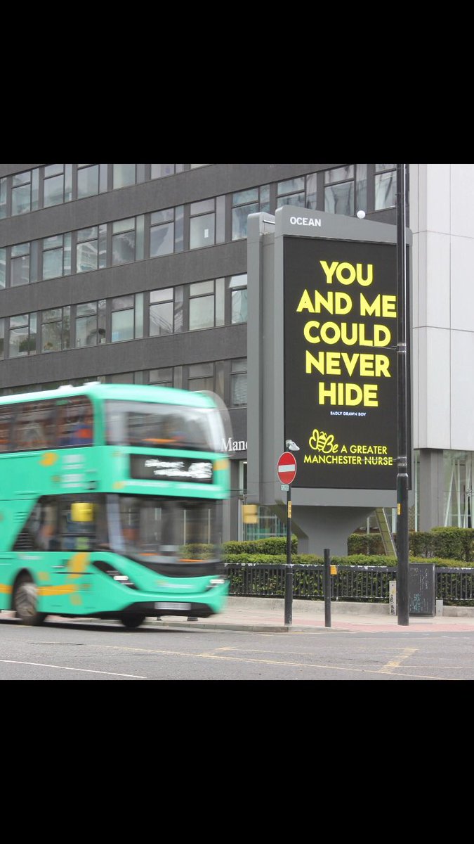 johnquirk1's tweet photo. Legendary Great Manchester singer songwriter @badly_drawn_boy has his lyrics emblazoned across the city in support of Nurses and the NHS. @TogetherMCR See the film https://t.co/lzLs18HVfS #unsung https://t.co/XVO6f2MOXH