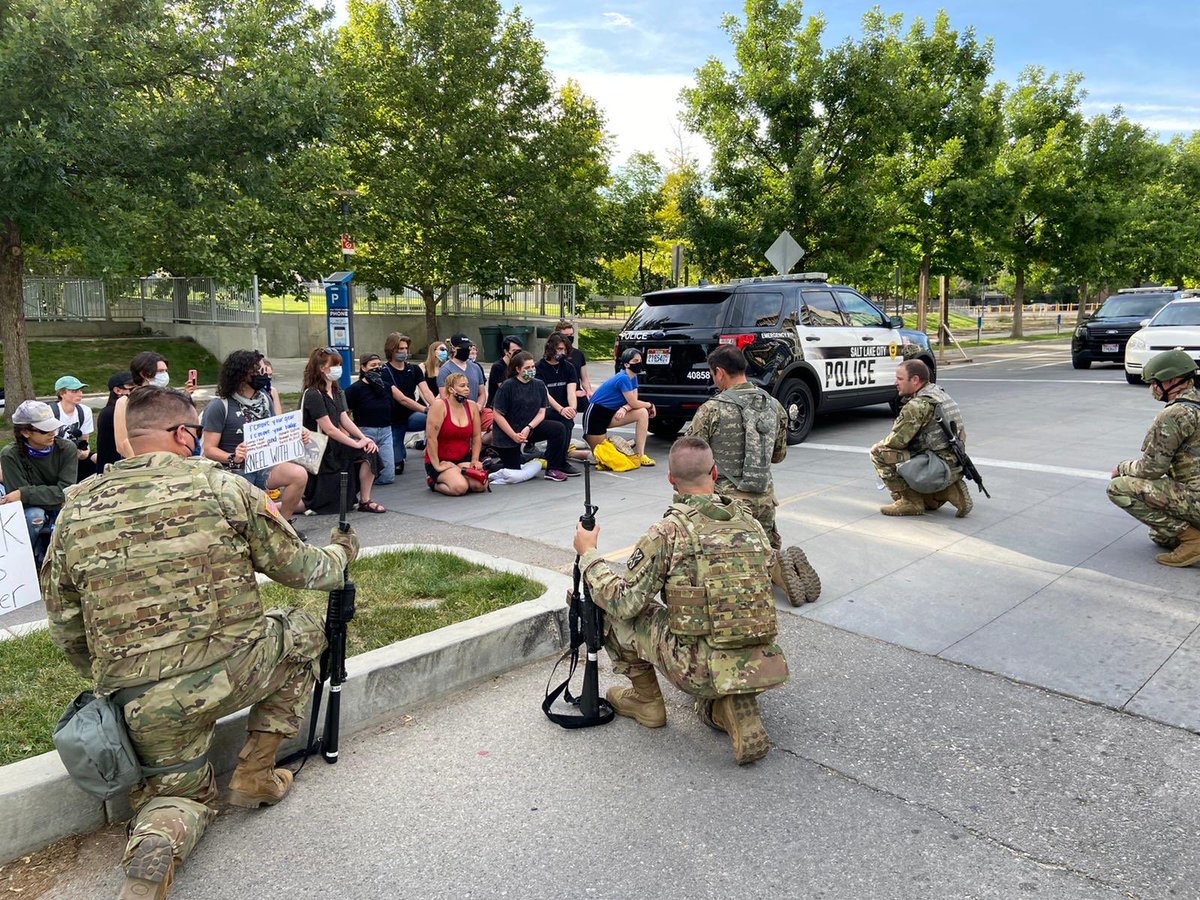 UTNationalGuard's tweet photo. Utah National Guard Soldiers and Salt Lake City police take a knee in solidarity with Utah chapter of @Blklivesmatter at the SLC Public Safety Building, June 2, 2020. (U.S. Army photo by SFC John Etheridge) https://t.co/0aLGzuukiW
