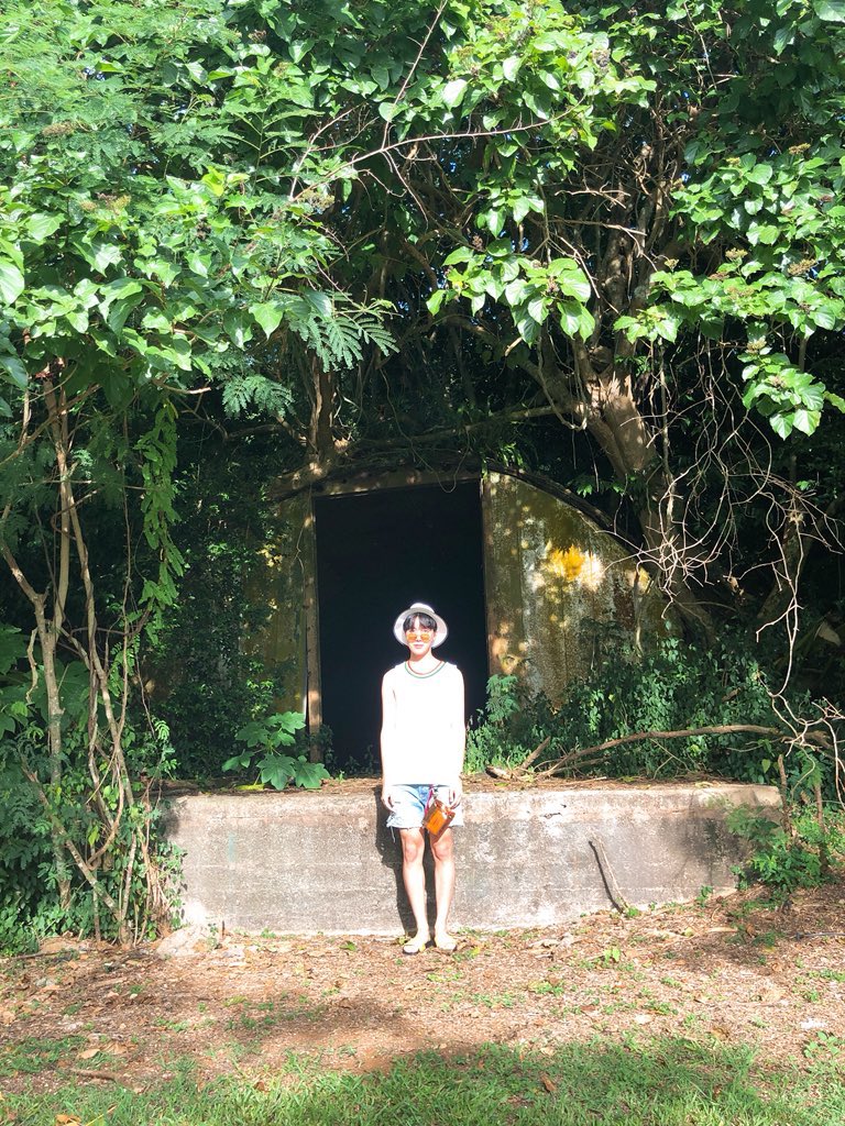 Perhaps one of my favorite photographs by Taehyung because of how effortless this image seems but it’s subtly, carefully composed. The foliage framing the entire photograph, but it’s the dark passage behind Hoseok (the subject) framing the very subject itself. So clever.