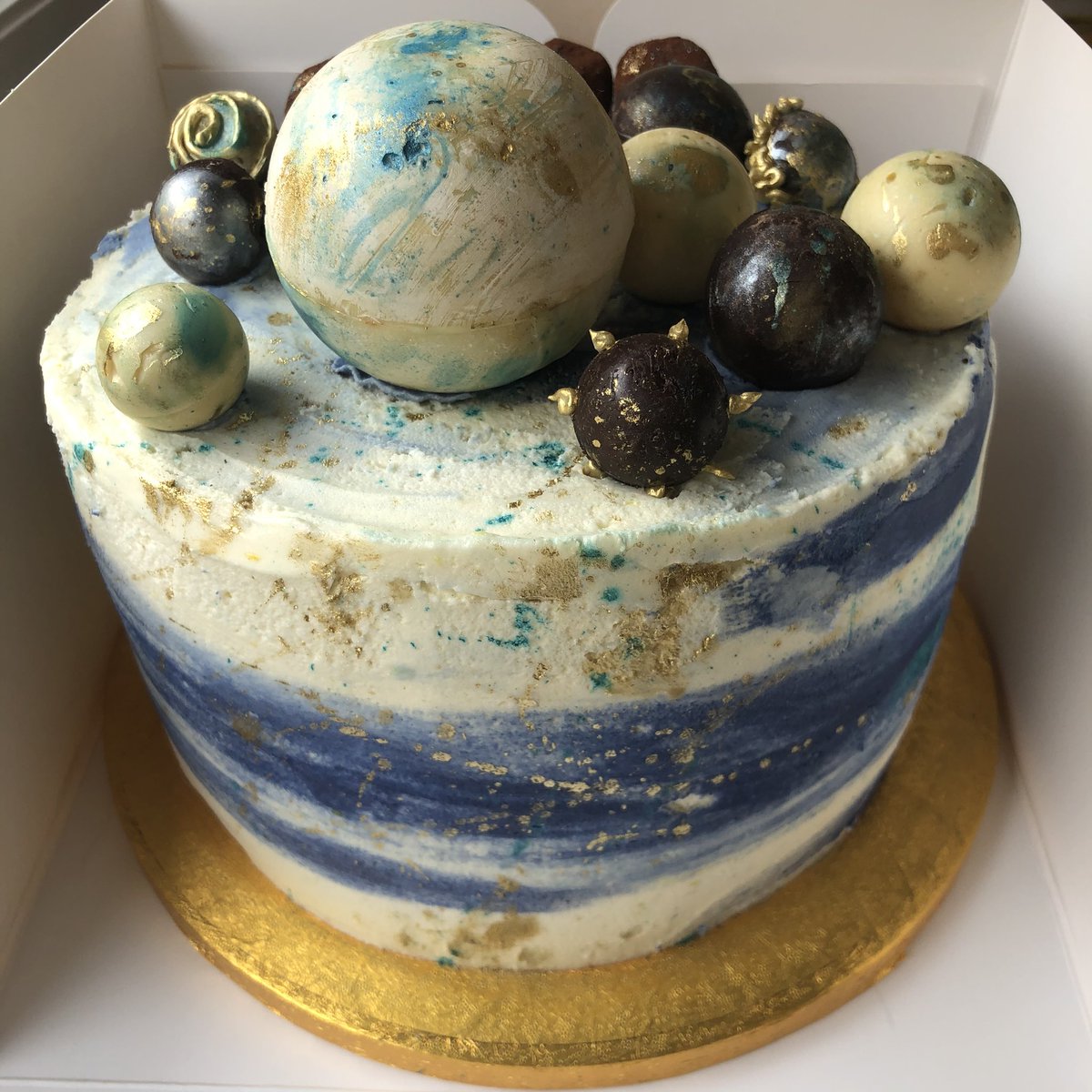 karmic_cakery's tweet photo. Handmade chocolate spheres containing a hidden message and sweet treats and handmade lemon oil truffles atop a hand painted cake. It’s on my bake bucket list to make this containing a hidden engagement ring /request , so if that’s you or anyone you know then PLEASE get in touch🌱 https://t.co/cRDMCqVqVd