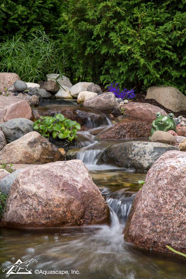 "WATERFRONT" LIVING

Have you always dreamed of living on the water? Create your own waterfront lifestyle today with the addition of a beautiful Aquascape backyard pond and waterfall like this one!