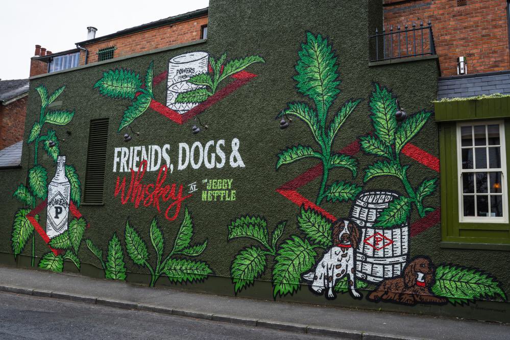 whiskey_paddy's tweet photo. I wouldn’t be a massive fan of “art” as such, but I do love a good pub mural.@PowersWhiskeyNI teamed up with Belfast’s #TheJeggyNettle and artist Danni Simpson for this beautiful celebration of #friendsdogsandwhiskey.I look forward to visiting &amp; enjoying the company of all three https://t.co/gxbIYKUTNH