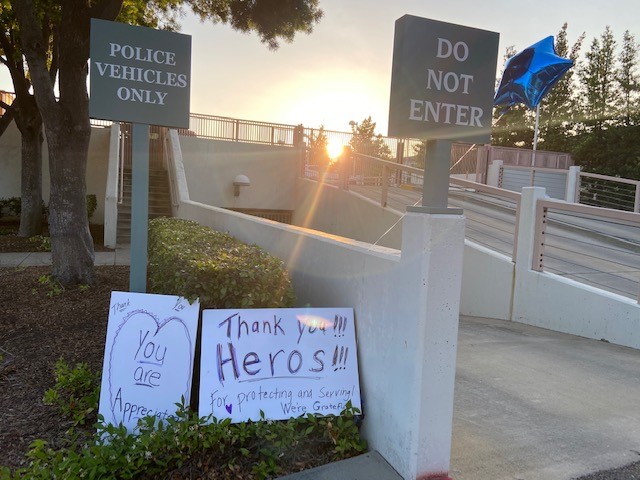 We are proud of the relationship we have with our community.  Someone left two signs in front of our building. It means more to us than you will ever know. Thank you!