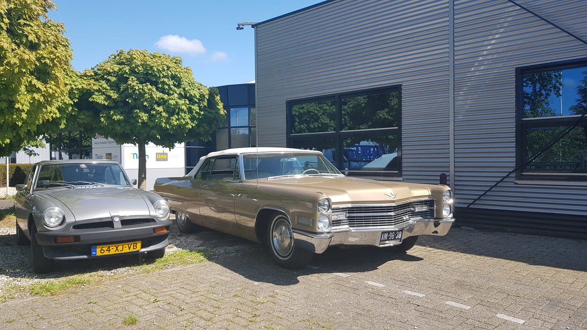 Great to have these beauties parked in front of our company building. #classiccars #MGB #Cadillac