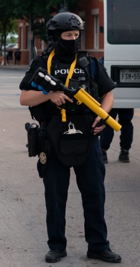 Dallas police have the sponge baton guns in yellow (attached image from June 1). Often they're black. I believe the gun can always only hold 1 or 2 batons that are shot 1 at a time [but always feel free to correct - I'm not an expert & lowkey hate how much I know about this shit]