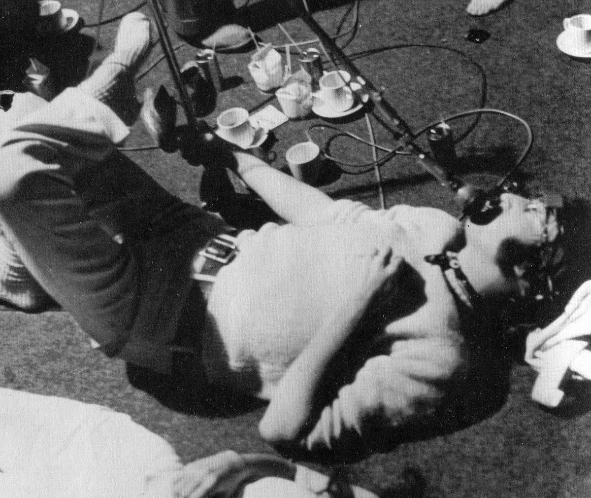 4 June 1968:

John Lennon lays down the lead vocals for Revolution 1. Photo: <a href="/beatlesfriend/">Tony Bramwell</a>.

"John decided he would feel more comfortable on the floor so I had to rig up a microphone which would be suspended on a boom above his mouth."

See more:

beatlesbible.com/1968/06/04/rec…