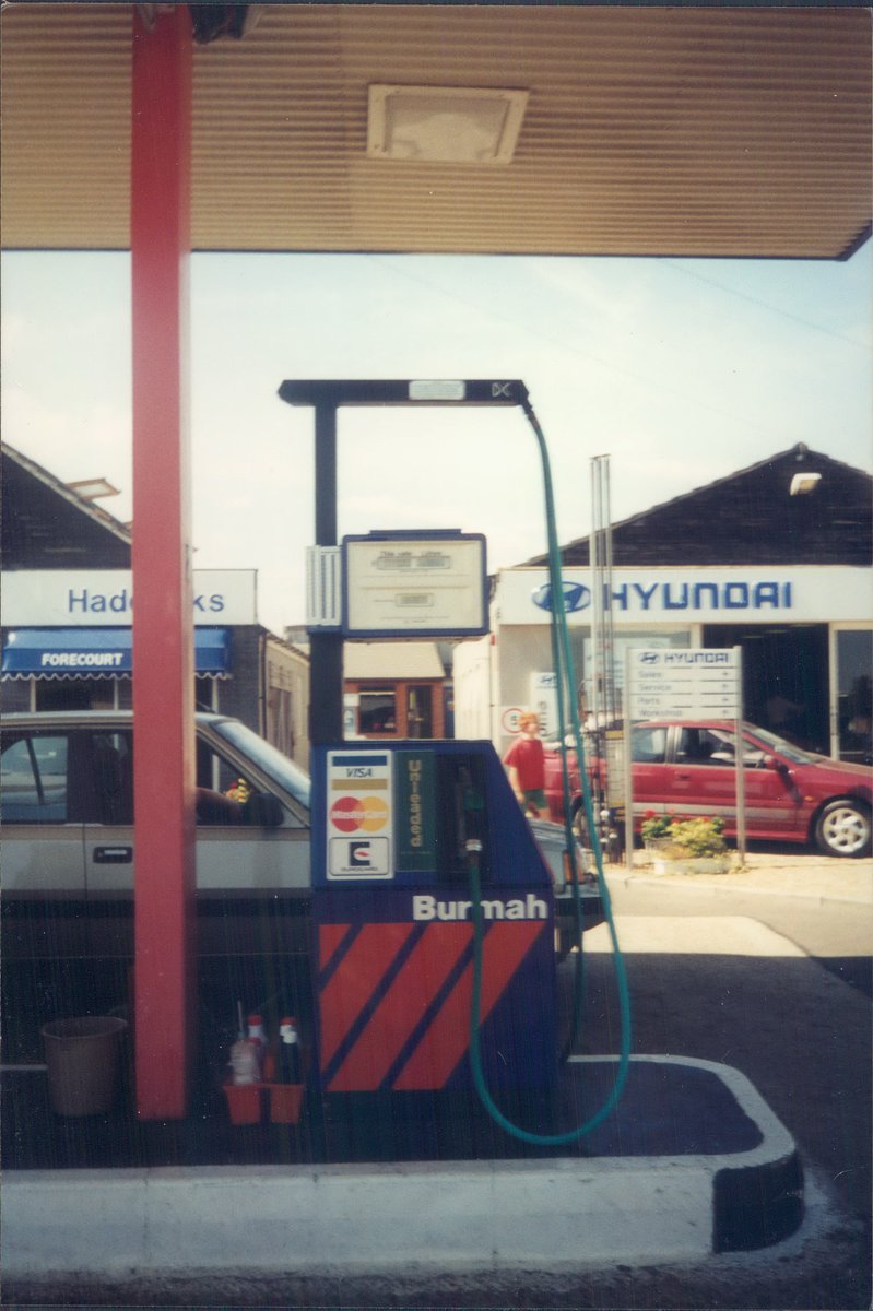 Day 164 of  #petrolstationsBurmah, Haddocks Hyundai, Fox Street, Essex, 1995  https://www.flickr.com/photos/danlockton/16230731926/  https://www.flickr.com/photos/danlockton/16070500909/  https://www.flickr.com/photos/danlockton/16070787377/Last days of the Burmah 'barrel' logo; the fuel business was bought by Save Service Stations in 1995. Note the Hyundai Scoupé.