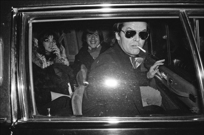 Jack Nicholson, smoking wearing sunglasses, candid, inside a limo