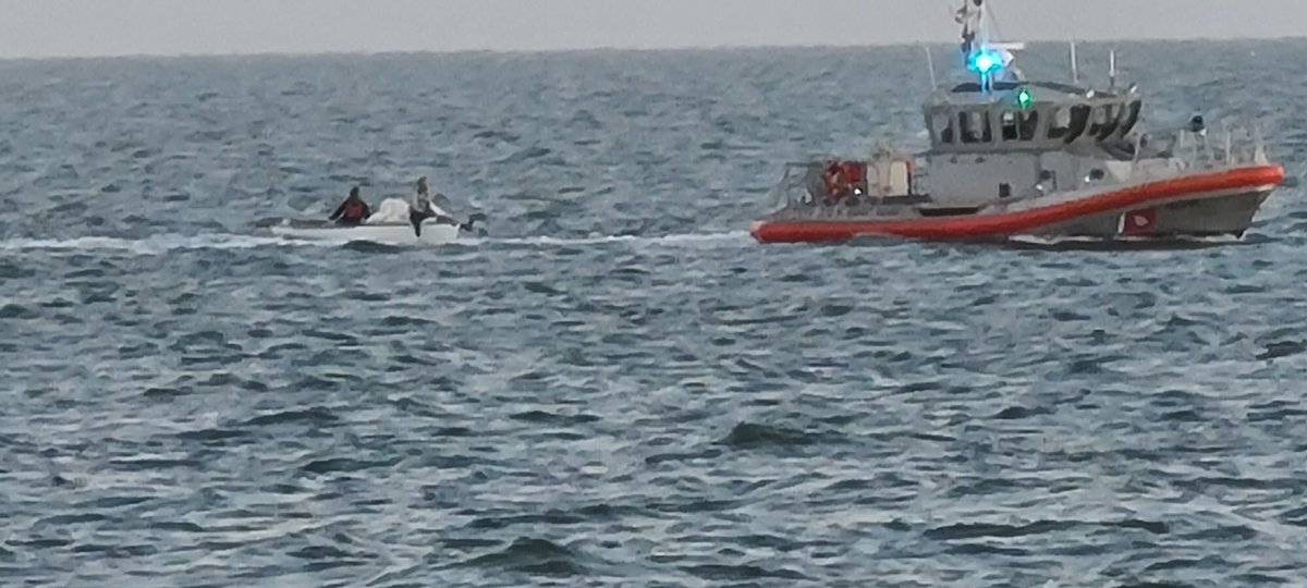 LauraAnthony7's tweet photo. #BREAKING @USCG just rescued two people from a capsized small sailboat in Ballena Bay off #Alameda . Witness says boat flipped over and was sinking. #USCG arrived within minutes and are towing them to safety. #abc7now https://t.co/CjI9JzCqS1