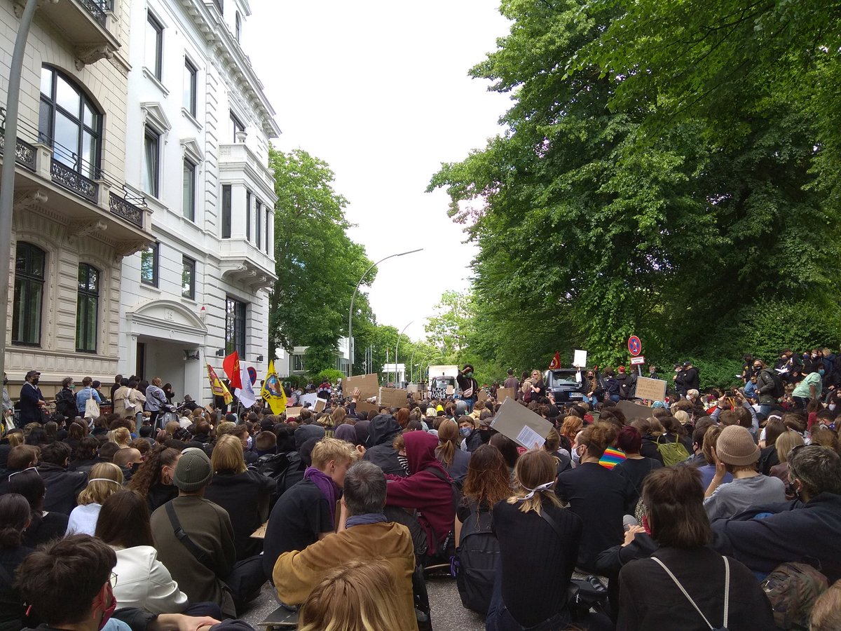 Sitting as protest against racism in Hamburg. Police is trying to end the manifestation but no one is moving. Black people are expressing their feelings/emotions/anger and everybody is quietly listening. #EnoughIsEnough #BlackLivesMatter