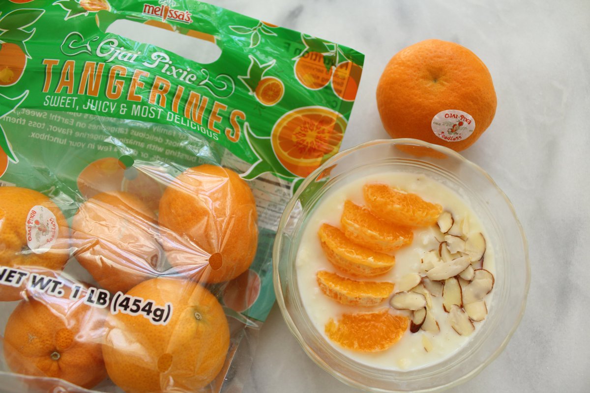 Infusing tangerine peel in my rice pudding gave the dessert such a lovely flavor! I garnished it with segments of sweet, juicy Ojai Pixie Tangerines and sliced almonds. @MelissasProduce #rice #pudding #dessert #tangerines #ricepudding