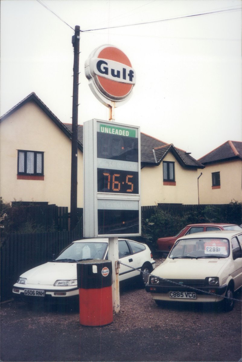 Day 166 of  #petrolstationsGulf, Bridge St Garage, Ipplepen, Devon 1999  https://www.flickr.com/photos/danlockton/16256436172/  https://www.flickr.com/photos/danlockton/16255404611/Gulf Oil (GB) was sold to Shell in 1997, but here the brand—via local distributor Heltor—was still on show on an array of 70s pumps. Metro+CR-X look appealing