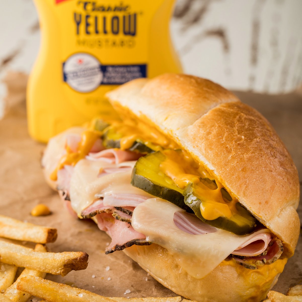 We LOVE a good Cuban Sandwich here at French’s HQ, and this hits ALL the spots. 🇨🇺🙌 It’s got all the essentials – sliced ham, roasted pork and melted Swiss cheese, but we’ve thrown in some extra pickles, fries and a generous layer of #FrenchsMustard. 😍 #ItsaMUST