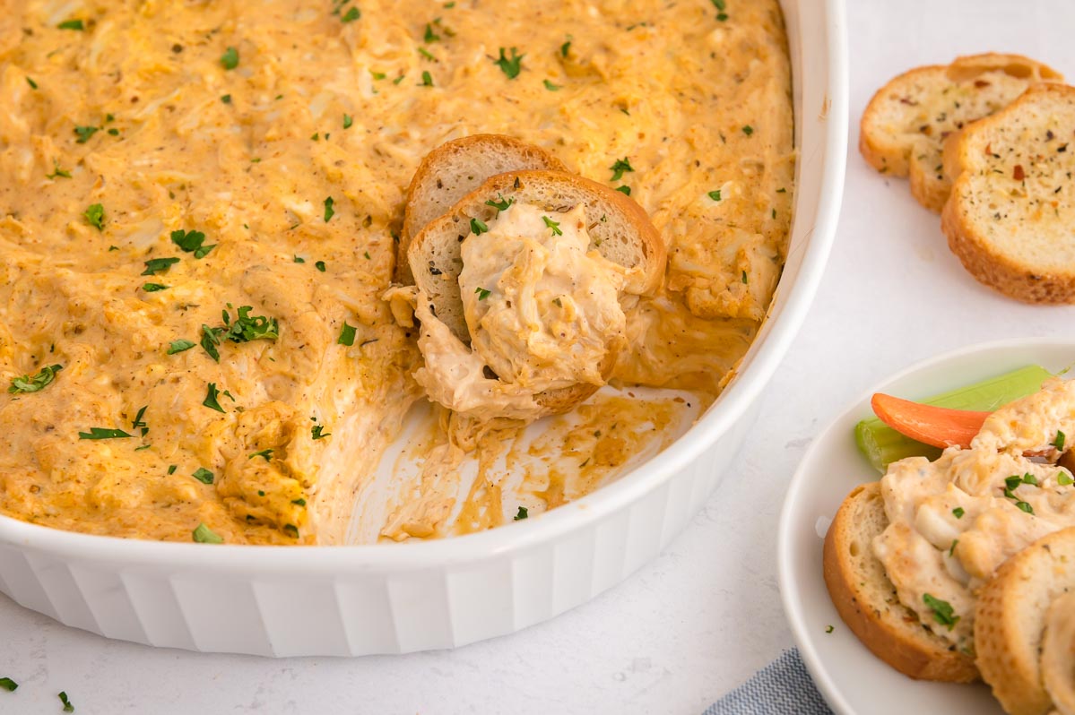 This Hot Crab Dip with Cream Cheese comes together in 10 minutes then you bake to bubbly, melty deliciousness.  Full Flavor of the crab, cheese and spices comes thru in every delicious bite! westviamidwest.com/hot-crab-dip-w…
