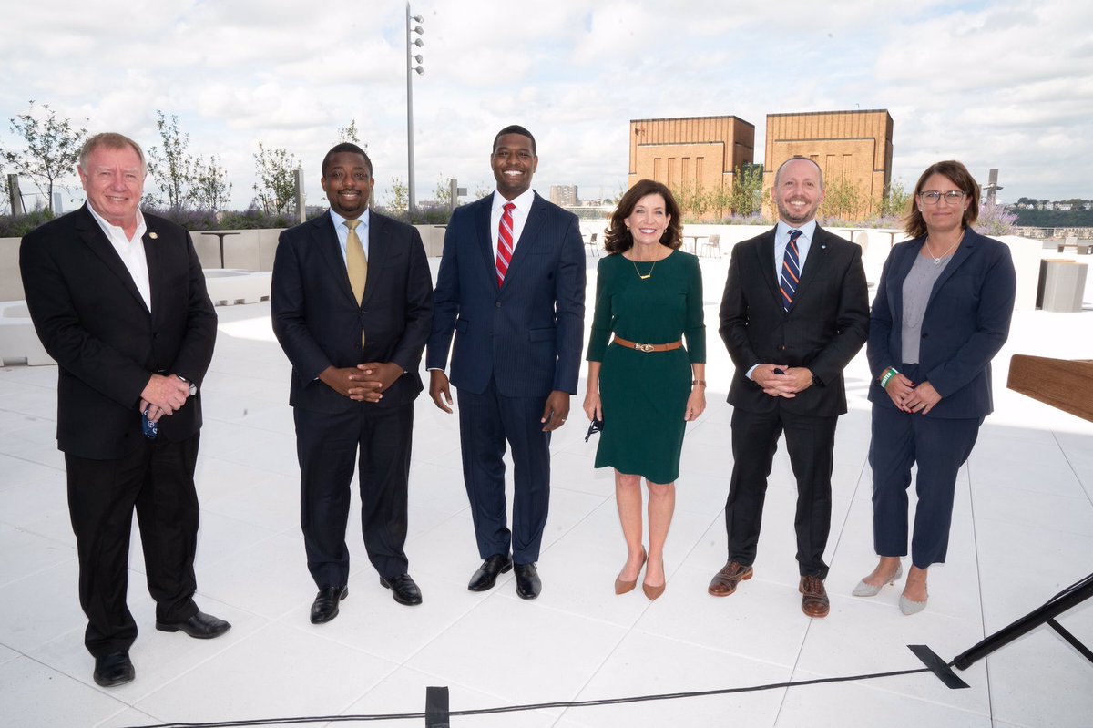 Governor Hochul (center right) stands with EPA Administrator Michael S. Regan (center), DEC Commissioner Basil Seggos (second right), NYSERDA President Doreen Harris (far right), Lieutenant Governor Brian Benjamin (second left), and CEO of Javits Alan Steel (far left)