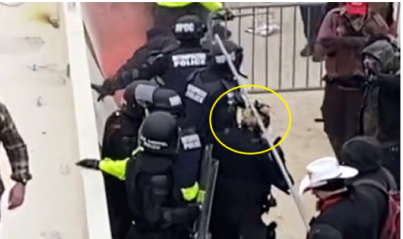 SeditionHunters's tweet photo. Why we do What we do! #SeditionHunters This officer shoved into the crowd and attacked by no less that 5 different men. What did he do when he got free? He went back to the line to stand guard again! #Respect https://t.co/NScAP0waCC