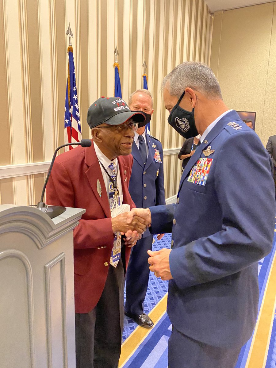 PACAF's tweet photo. Gen. Wilsbach, PACAF commander, and Cindy Wilsbach, PACAF First Lady, meet Lt. Col. (ret.) James Harvey, a Tuskegee Airman of the famed “Red Tails” unit, during the Air Force Association’s Air, Space, and Cyber Conference, Sept. 21. https://t.co/28zRn6P6n0