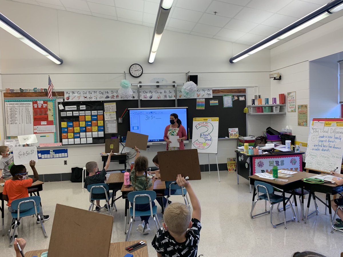 hes_smcps's tweet image. HES Herons in Mrs.  Pasquale’s 1st grade classroom showing their work during math time.
