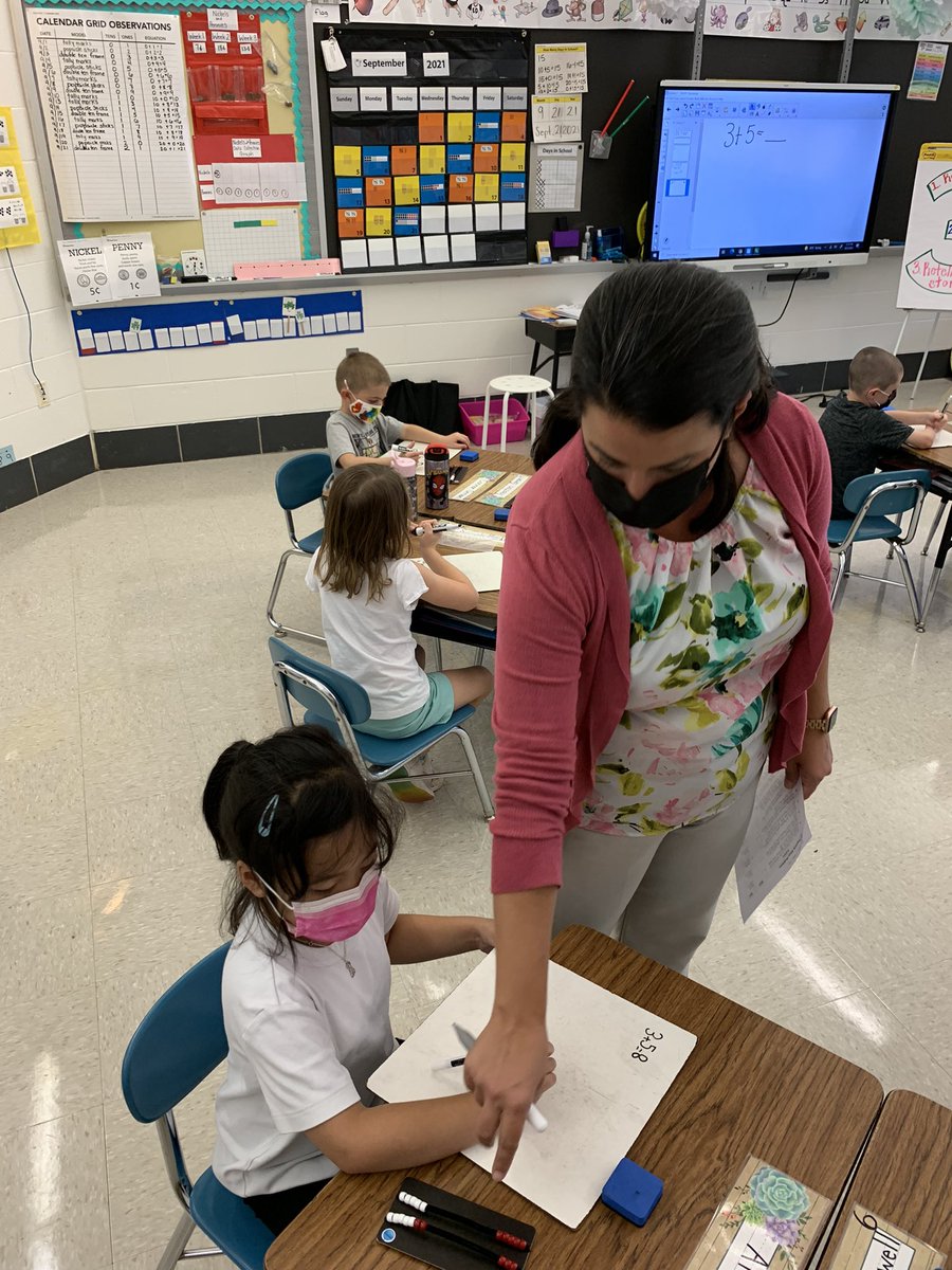 hes_smcps's tweet image. HES Herons in Mrs.  Pasquale’s 1st grade classroom showing their work during math time.
